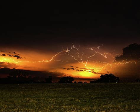 Orange Lightning Photograph by Jay Stockhaus