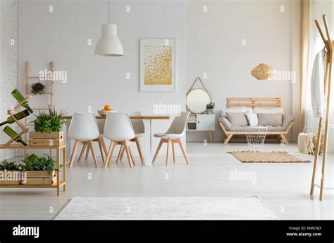 White and modern dining room with wooden furniture Stock Photo - Alamy