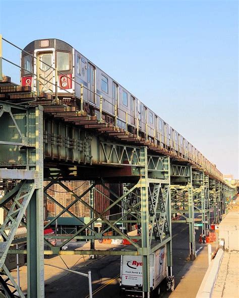 An 4 train runs on the elevated rail line just outside the Livonia ...