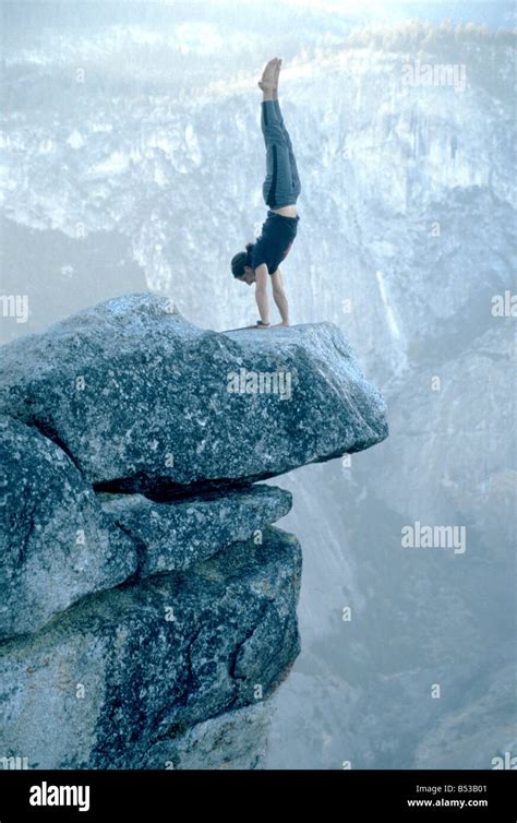 Performing a handstand on "Overhanging Rock" at Glacier Point Stock ...