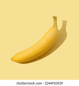 Banana Isolated On Yellow Background Stock Photo 2244910529 | Shutterstock