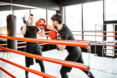 Man Training with Boxing Coach on the Boxing Ring Stock Image - Image of fight, lifestyle: 137600705