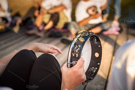 Person playing tambourine | Arts & Entertainment Stock Photos ~ Creative Market