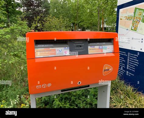 Netherlands Post Nl mail box at Tilburg university campus. Tilburg, North Brabant / Netherlands ...