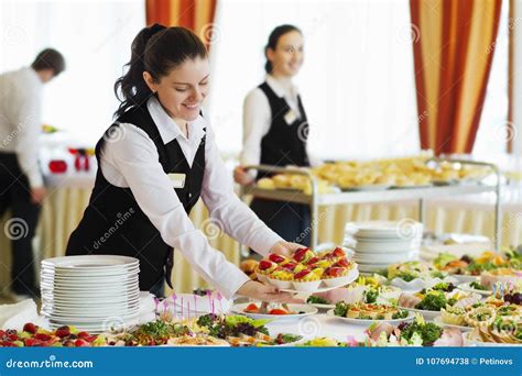 Restaurant Waitress Serving Table with Food Stock Photo - Image of ...