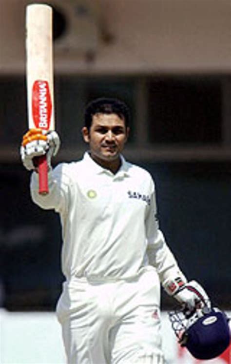 Virender Sehwag is congratulated by Sachin Tendulkar after getting to his triple-century ...