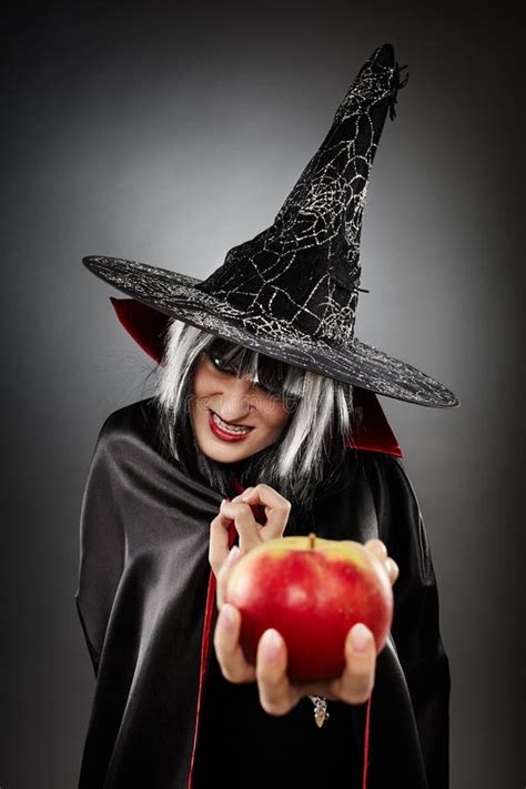 Witch Offering A Poisoned Apple Stock Image - Image: 36441087