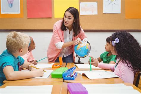 Students Listening To the Teacher Stock Photo - Image of classmates, black: 58127218