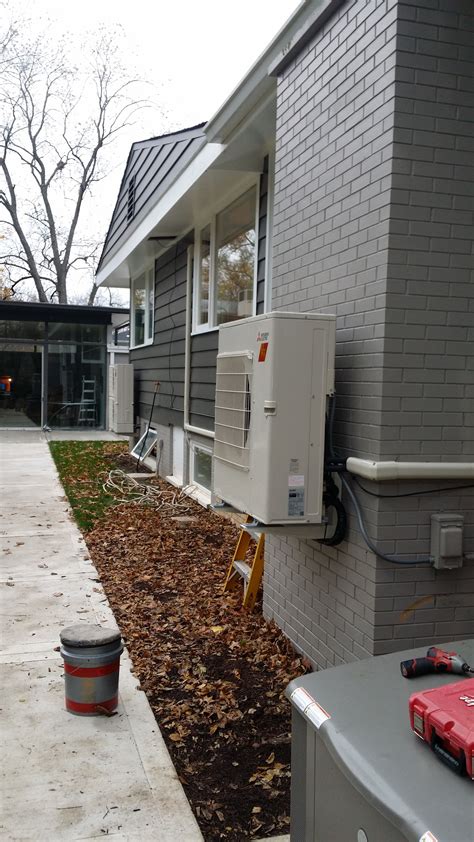 Mitsubishi multi zone unit mounted on wall brackets | Ductless heating ...