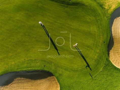 Professional golfers playing on putting green – Jacob Lund Photography ...