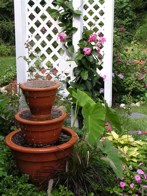 Pots for the garden made into a water feature | Backyard water feature ...