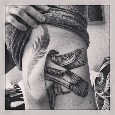 Feather and egyptian falcon tattoo on ribs Tattoos And Piercings, Tatoos, Thunderbird Tattoo ...