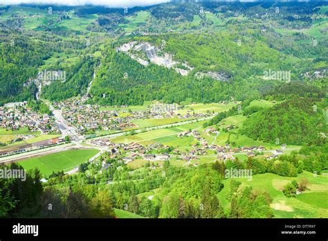 Swiss village at Alps Stock Photo - Alamy