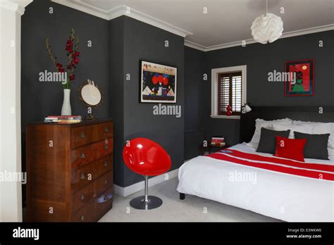 Red, white and grey colour scheme in modern bedroom, Brighton, Sussex ...