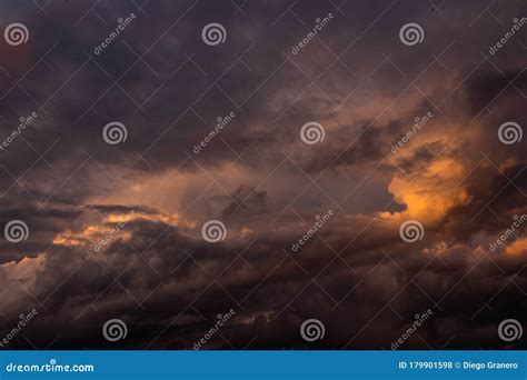 Stormy clouds at sunset stock photo. Image of dark, orange - 179901598