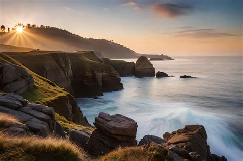 Premium Photo | A sunset over the ocean with a rocky cliff and the ...