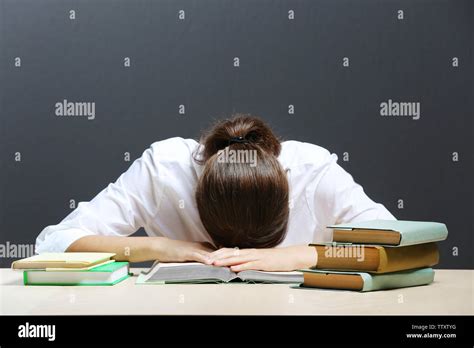 Student tired of studying in classroom Stock Photo - Alamy