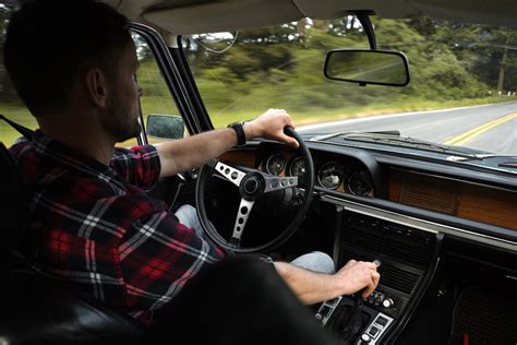 Male driver focused on driving while traveling by car · Free Stock Photo