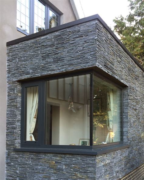 Nutshell Cottage remodelling by Roger Meyer Architecture - Corner glazed window with black slate ...