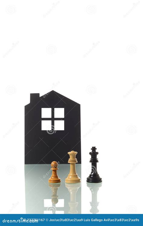 Chess Pieces with Silhouette of a House in the Background Stock Image ...