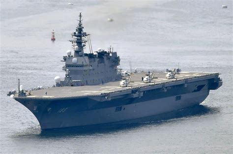Japan to spend more on defense, refit first aircraft carrier | AP News
