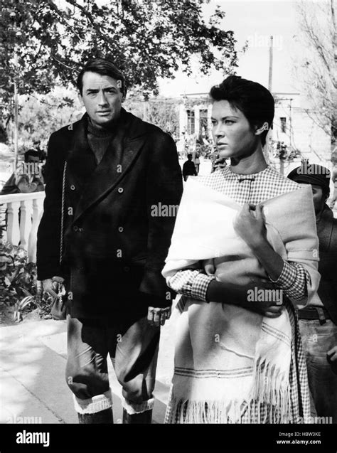 THE GUNS OF NAVARONE, from left: Gregory Peck, Gia Scala, on location ...