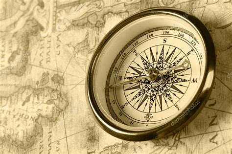 Old compass on ancient map Stock Photo by ©galdzer 5945057