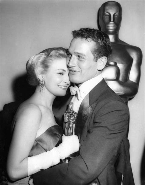 Oscar-winning actress Joanne Woodward is embraced by her husband, actor Paul Newman, backstage ...