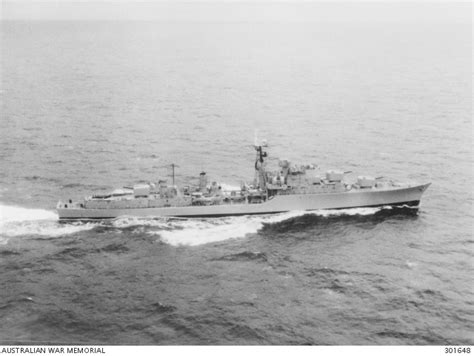 C.1957. AERIAL STARBOARD SIDE VIEW OF THE DESTROYER HMAS VOYAGER (II). SHE IS FLYING NO ENSIGN ...