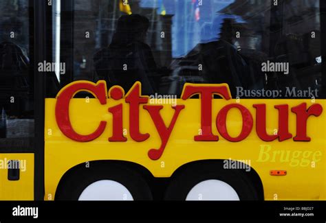 City tour bus in Bruges Belgium Stock Photo - Alamy