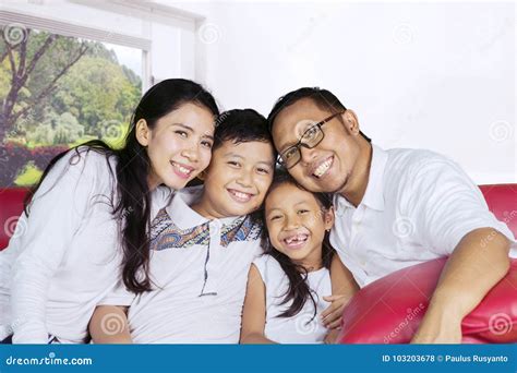 Happy Family Laughing Together on the Couch Stock Photo - Image of ...