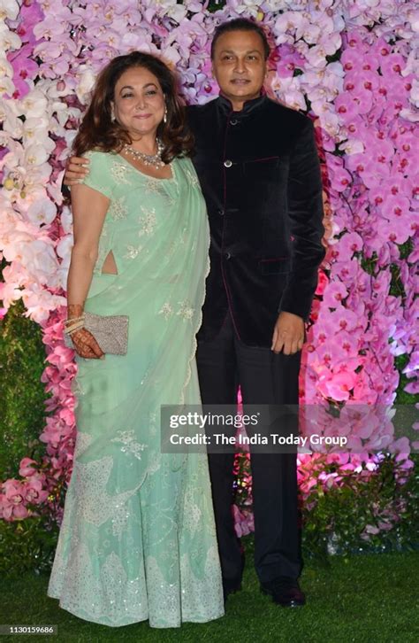 Anil Ambani and Tina Ambani pose for a photograph at Akash Ambani &... News Photo - Getty Images