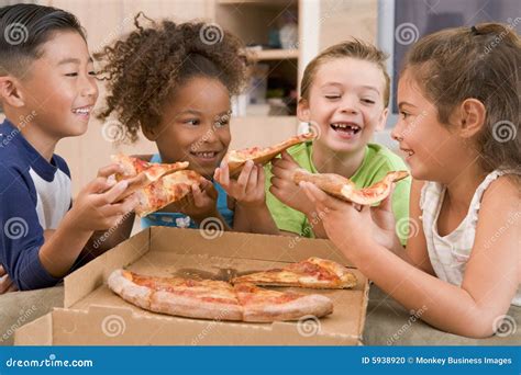 Four Young Children Indoors Eating Pizza Stock Photo - Image of length ...