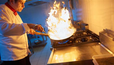 chef in hotel kitchen prepare food with fire 12113652 Stock Photo at ...