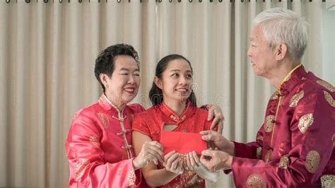 Family Greeting Red Envelop at Chinese New Year Celebration Stock Photo - Image of gold, festive ...