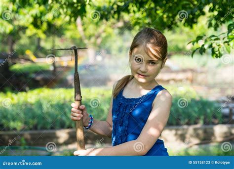 Portrait of Girl in Vegetable Garden with Hoe Stock Image - Image of ...