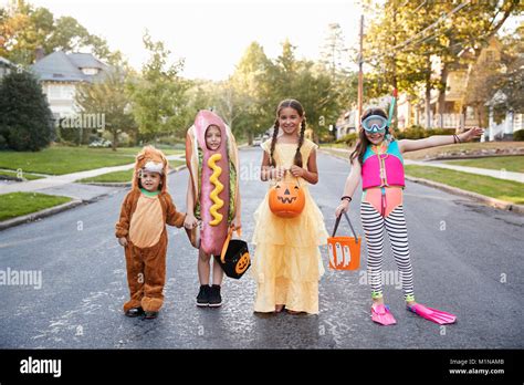 Children Wearing Halloween Costumes For Trick Or Treating Stock Photo ...