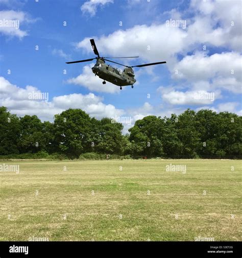 Chinook helicopter landing in a public field Stock Photo - Alamy