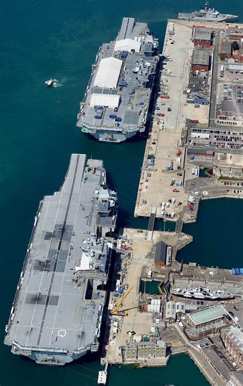 HMS Prince of Wales (top) and HMS Queen Elizabeth (bottom) alongside ...