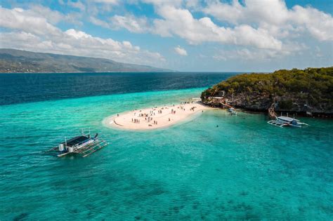 Aerial view of Sumilon Island's famous white sand bar in Oslob, Cebu, Philippines that attracts ...