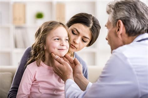 Mom with kid at the doctor. | Pediatrician doctor examining … | Flickr