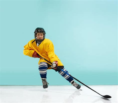 Premium Photo | A hockey player with equipment over a blue