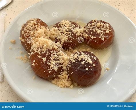 Turkish Dessert Kemalpasa with Hazelnut Powder and Sherbet / Serbet ...