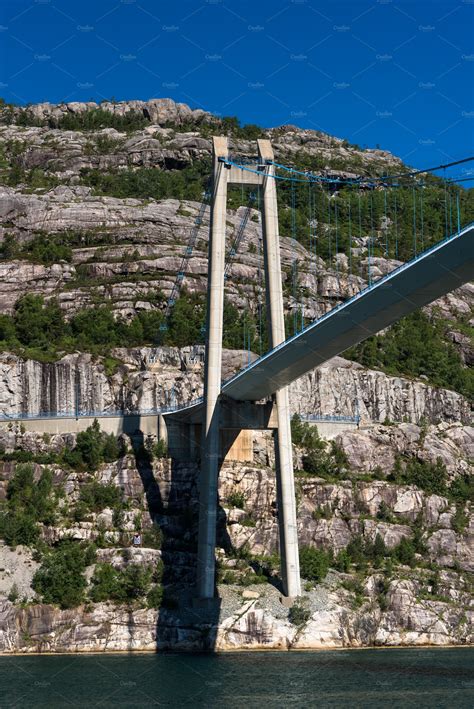 Suspension bridge over the fjord i containing bridge, sea, and water ...