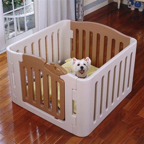 a small white dog sitting inside of a wooden crib in a room with ...