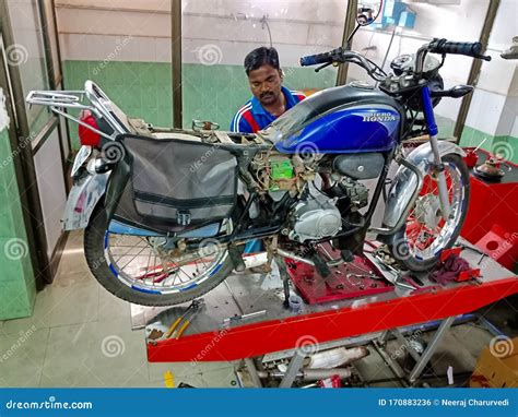 An Indian Mechanic Repairing Hero Honda Bike at Service Center in India ...