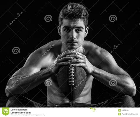 Football Player Portrait Holding American Football Staring. Stock Image - Image of football ...