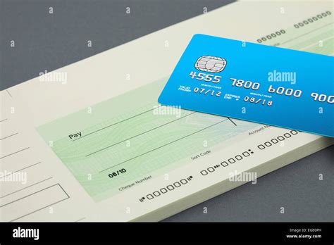 Cheque book and bank card Stock Photo - Alamy