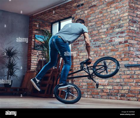 A handsome man with BMX in a studio Stock Photo - Alamy