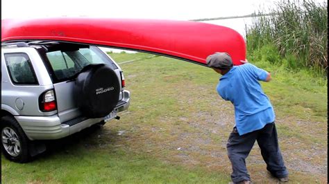 How to mount a canoe to your vehicle... cheap! - YouTube